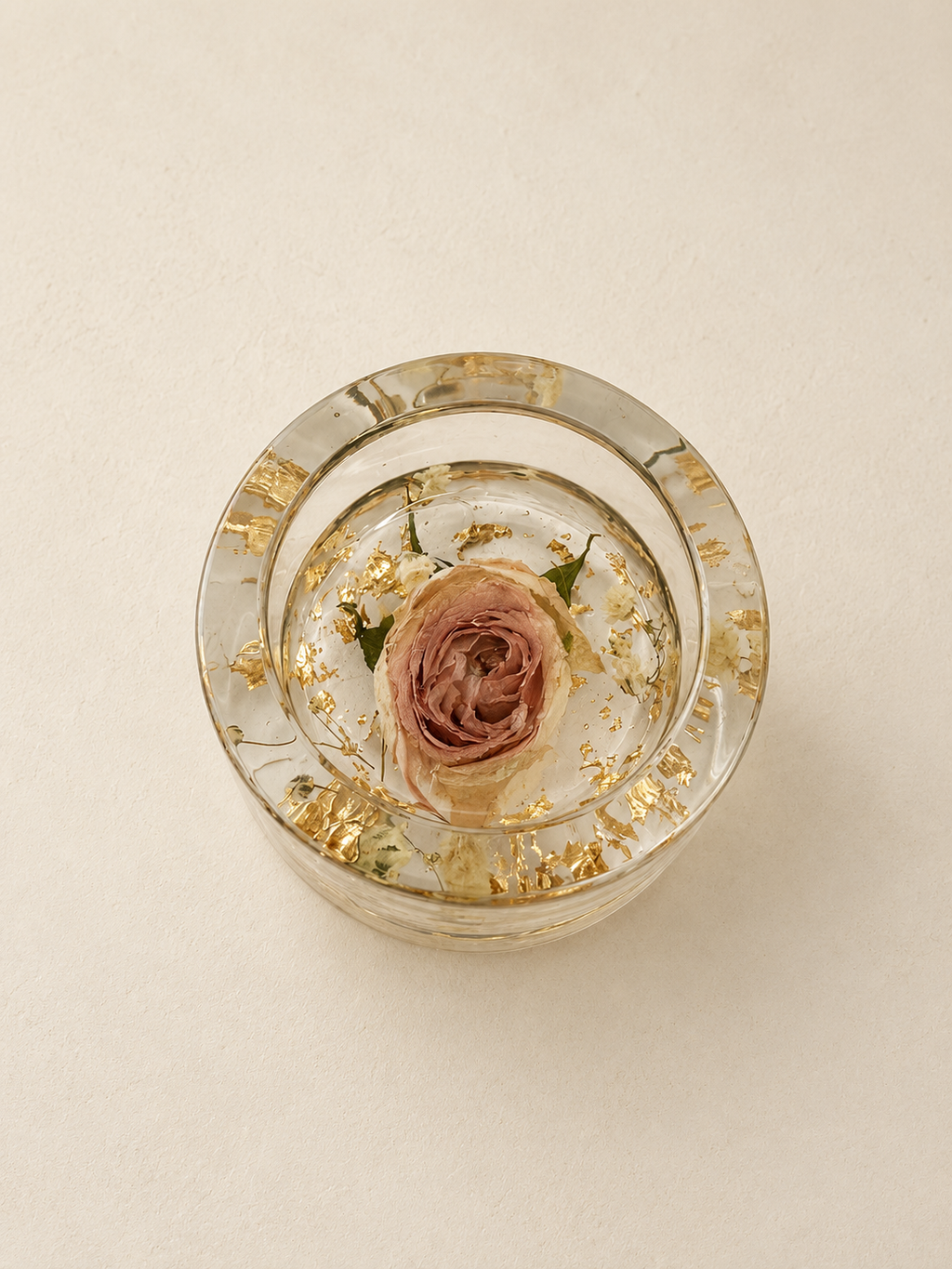 Top view of a real blush rose and delicate floral details in a clear resin candle holder, handmade in Lancashire UK by Held Forever Studio
