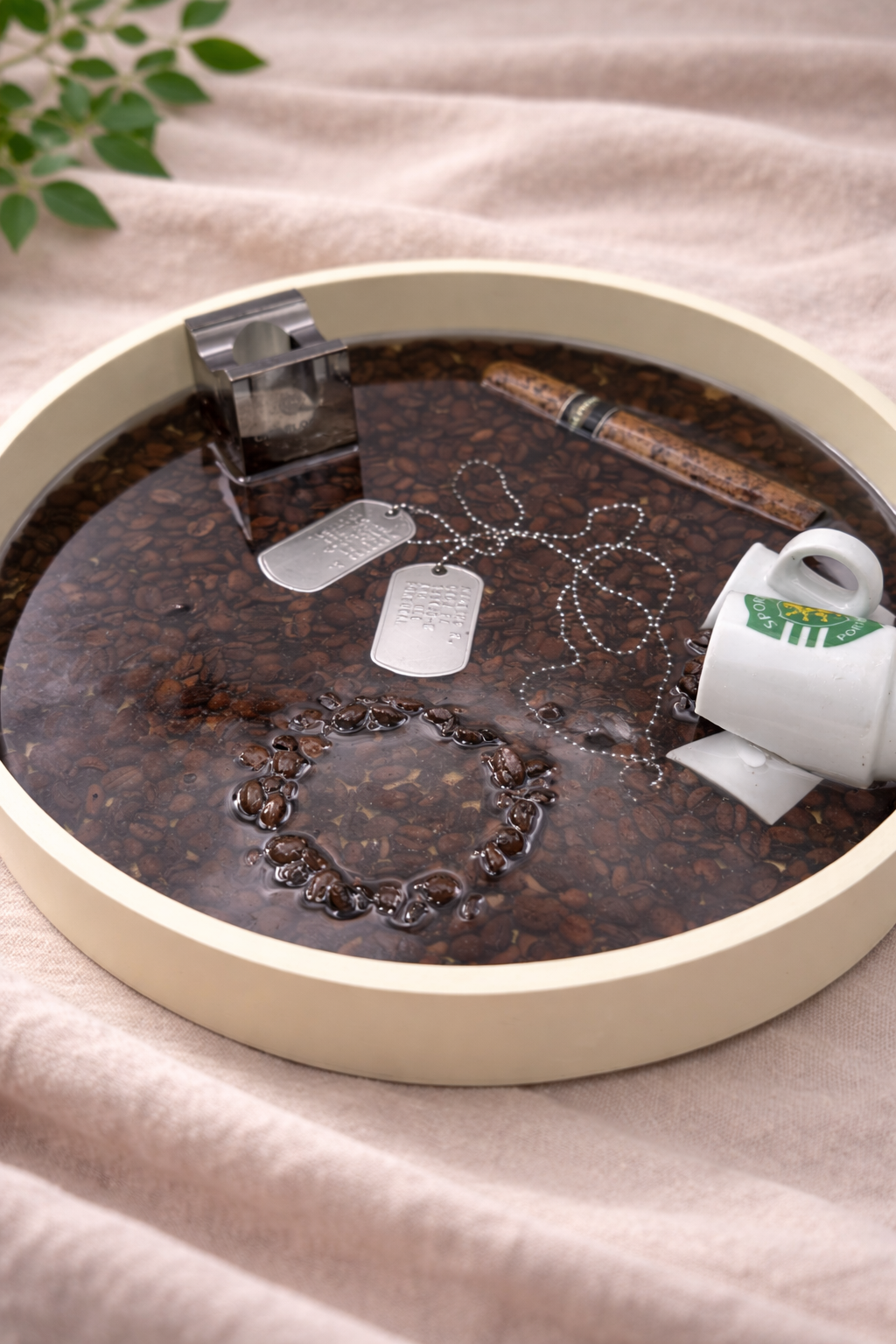 Detail of personal items embedded in custom resin tray, hand-poured in Lancashire UK by Held Forever Studio