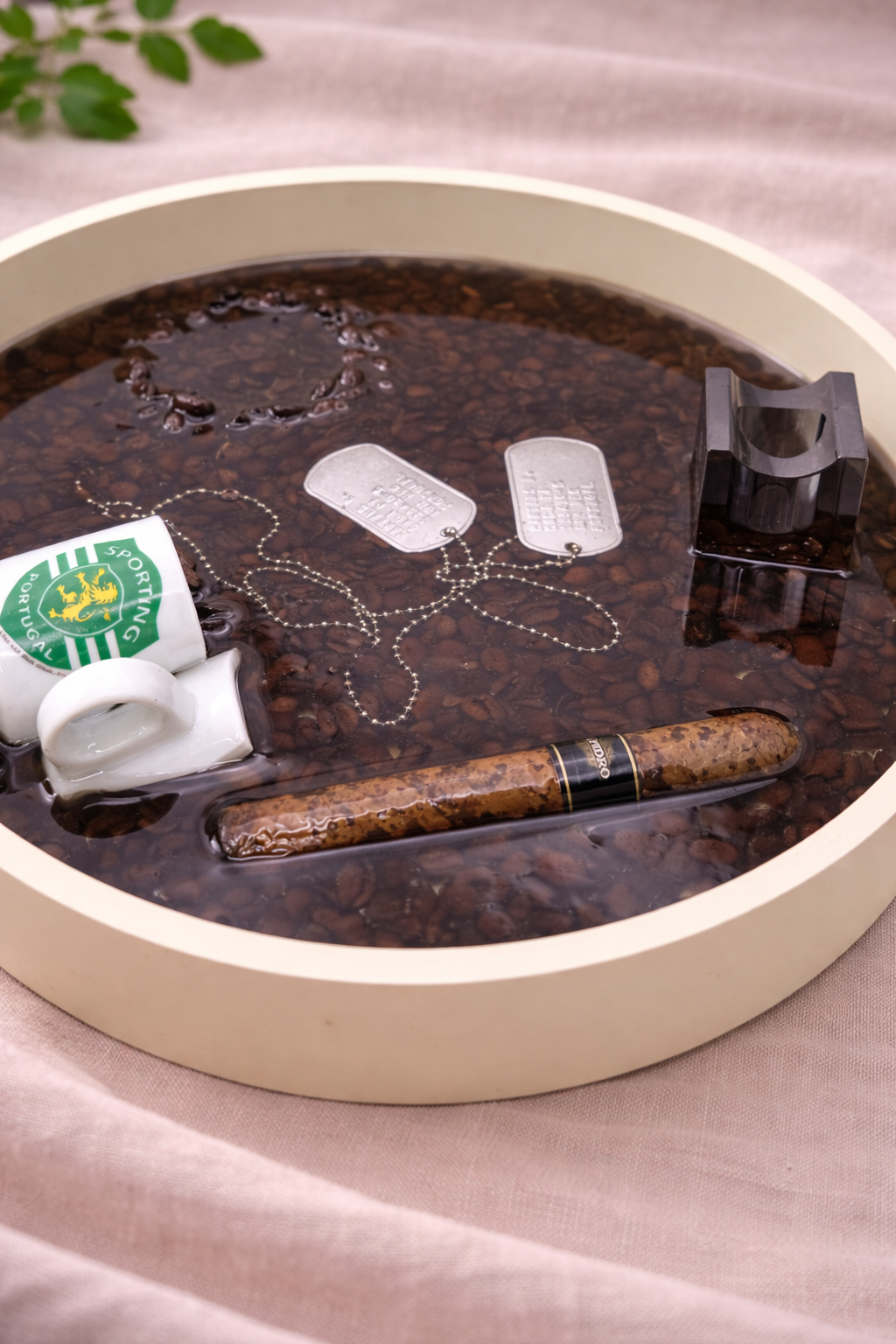 Bespoke resin tray with customer personal items preserved forever in dark epoxy resin, made to order by Held Forever Studio