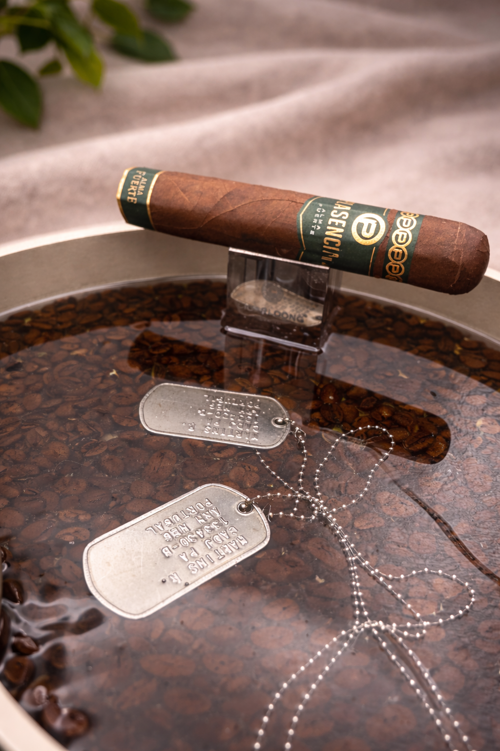 Bespoke personalised resin tray with coffee beans and personal keepsakes embedded in dark epoxy resin, handmade by Held Forever Studio
