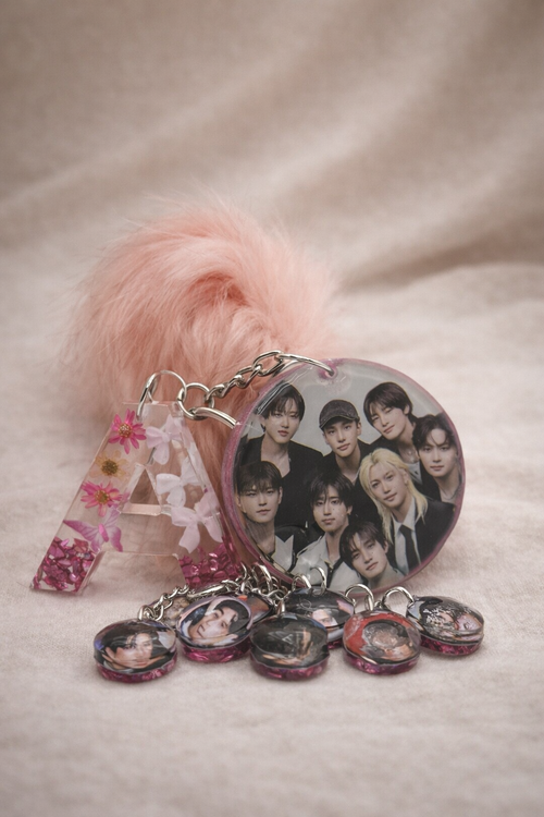 K-pop fan keychain with individual member photo dome charms on silver chains, handmade by Held Forever Studio