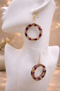 Resin hoop earrings with real dried burgundy flowers and gold foil flakes on 925 gold-plated silver hooks, handmade by Held Forever Studio