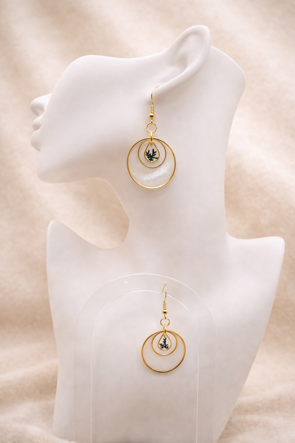 Pearl resin drop earrings with gold-plated double hoop frames and botanical inclusion, handmade by Held Forever Studio