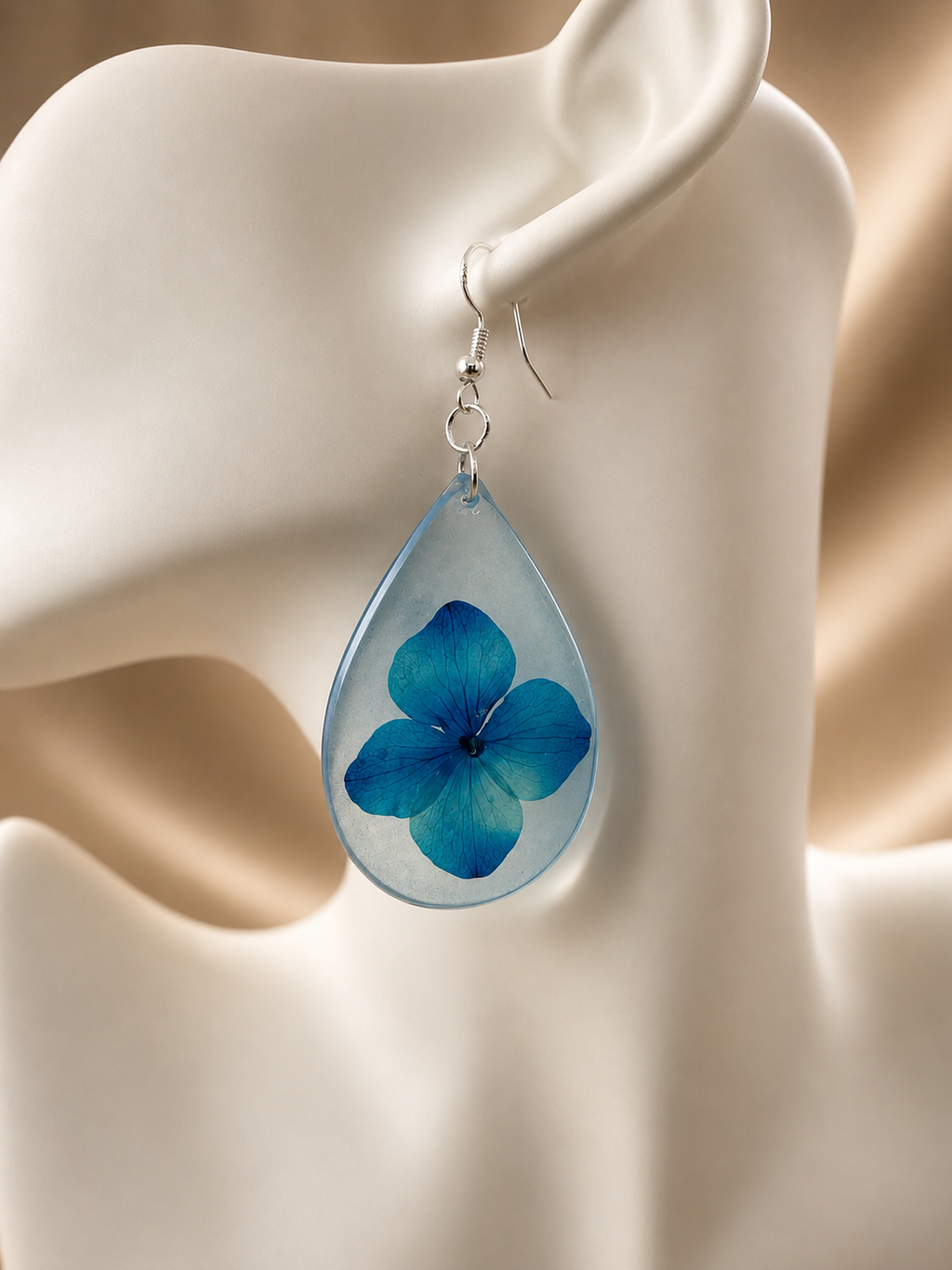Handmade pressed blue hydrangea resin teardrop drop earrings, botanical jewellery by Held Forever Studio Lancashire UK