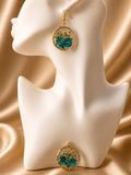 Pressed flower resin earrings with blue hydrangea and white gypsophila in clear UV resin, gold twisted rope circular frame, handmade in Lancashire UK by Held Forever Studio
