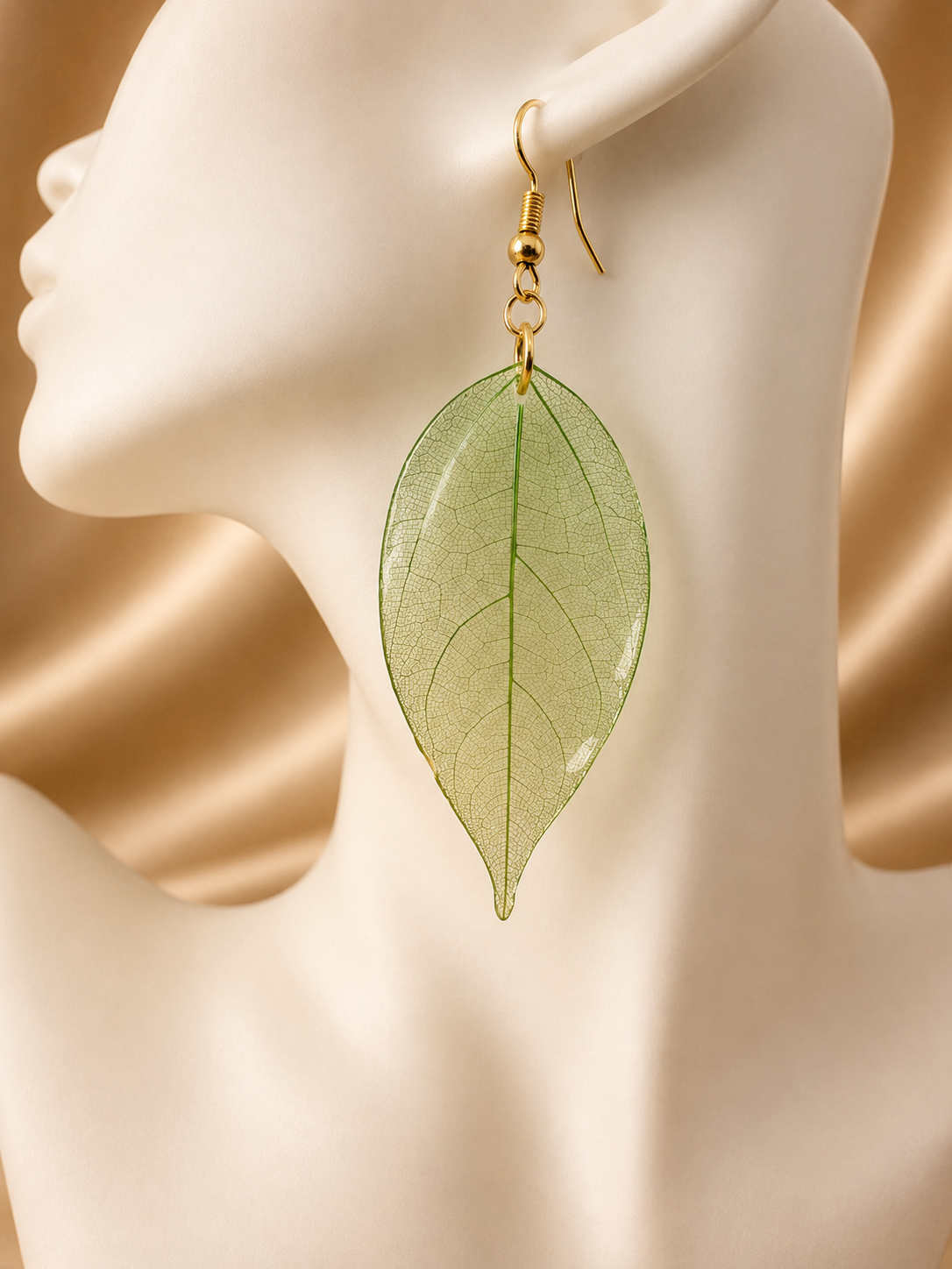 Pair of real skeleton leaf drop earrings in silver showing intricate natural patterning, handmade in Lancashire UK