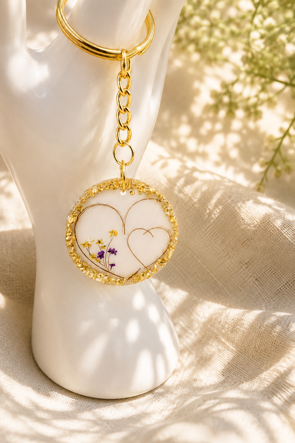 Real pressed flower resin keyring first haircut keepsake on ceramic stand, handmade in Lancashire UK by Held Forever Studio