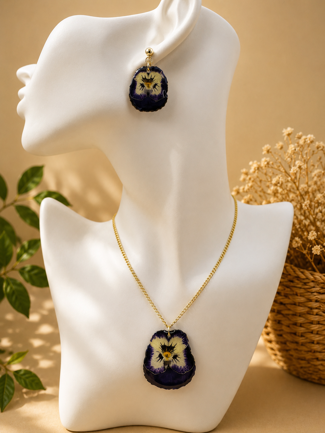 Close up of pansy resin pendant necklace with 24K gold plated chain, handmade by Held Forever Studio