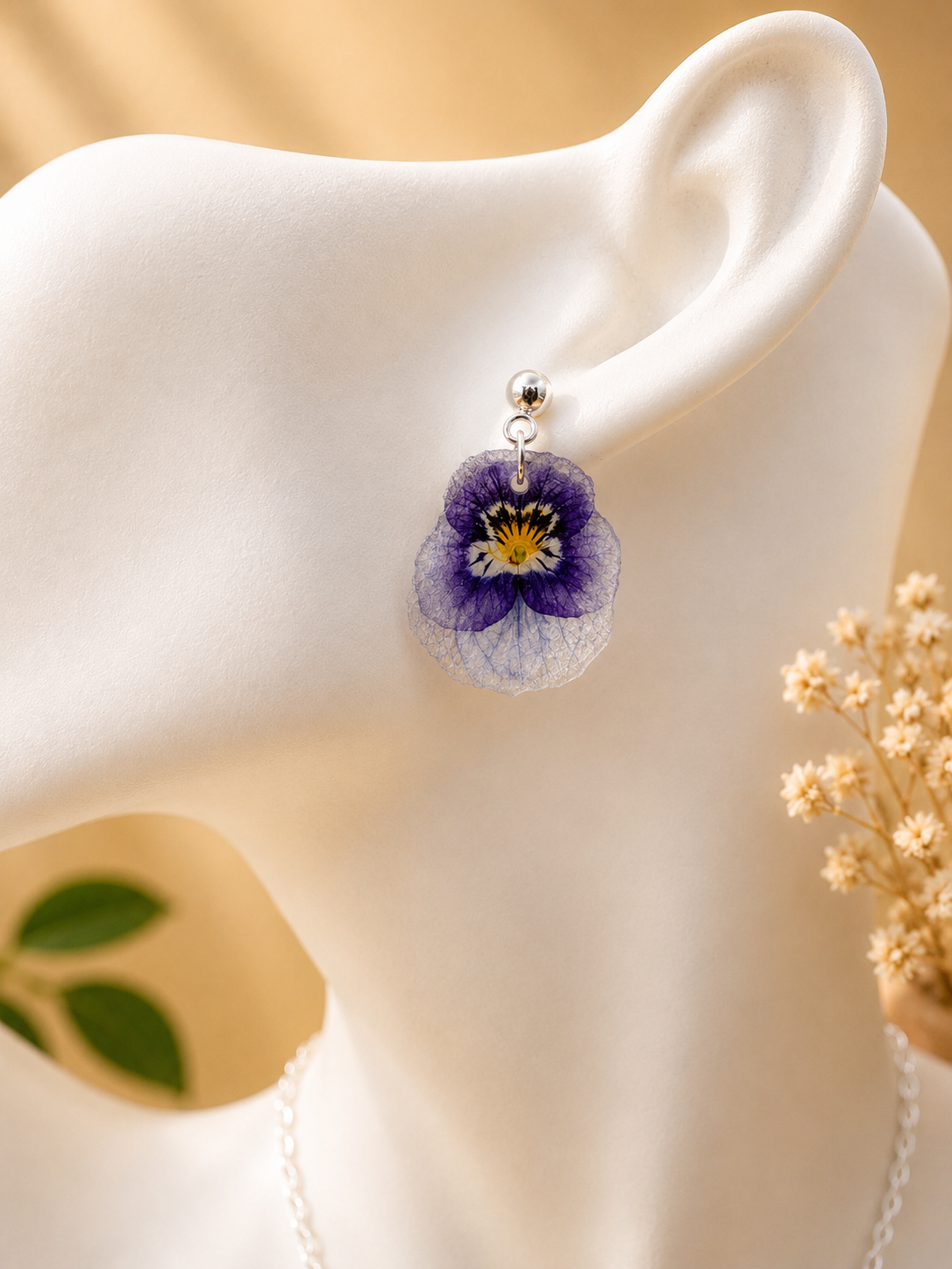 Pansy resin earring and necklace worn together, real pressed pansy flowers in 925 sterling silver, handmade in Lancashire UK