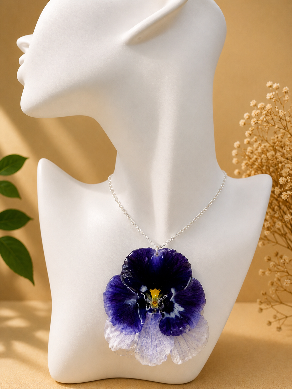 Close up of pansy pressed flower pendant necklace showing real flower detail and 925 sterling silver chain, handmade in Lancashire UK