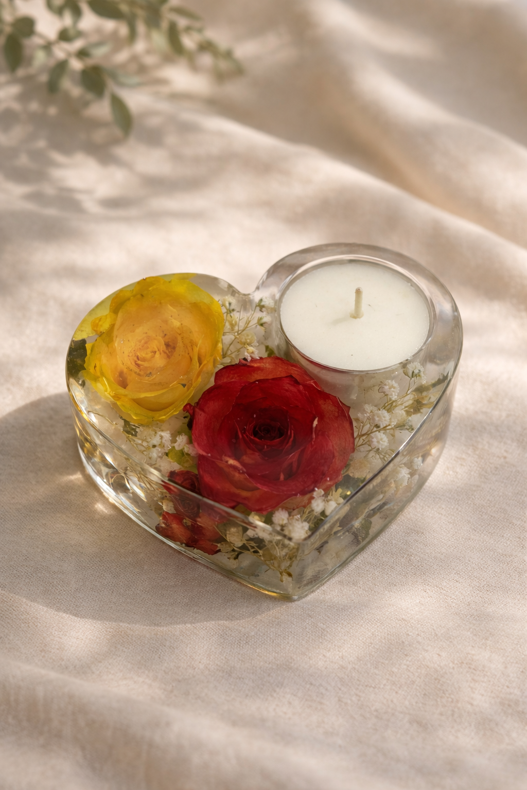 Side view of heart shaped resin candle holder with dried roses, handmade in Lancashire UK