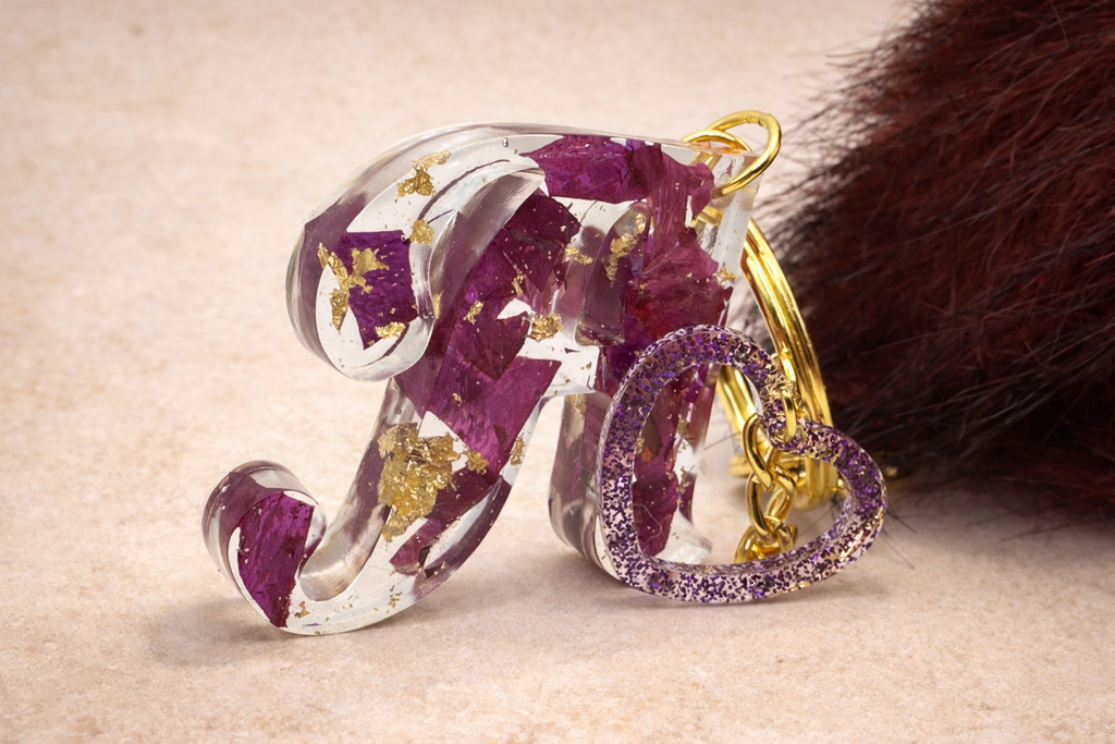 Resin initial letter keyring with heart charm and faux fur pom pom, handmade gift by Held Forever Studio