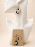 Teardrop resin earrings with real pressed blue forget-me-not flowers and gold leaf, handmade by Held Forever Studio