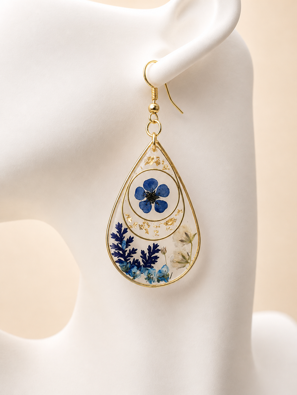 Pressed flower teardrop resin earrings displayed with Held Forever Studio jewellery card, handmade in Lancashire UK
