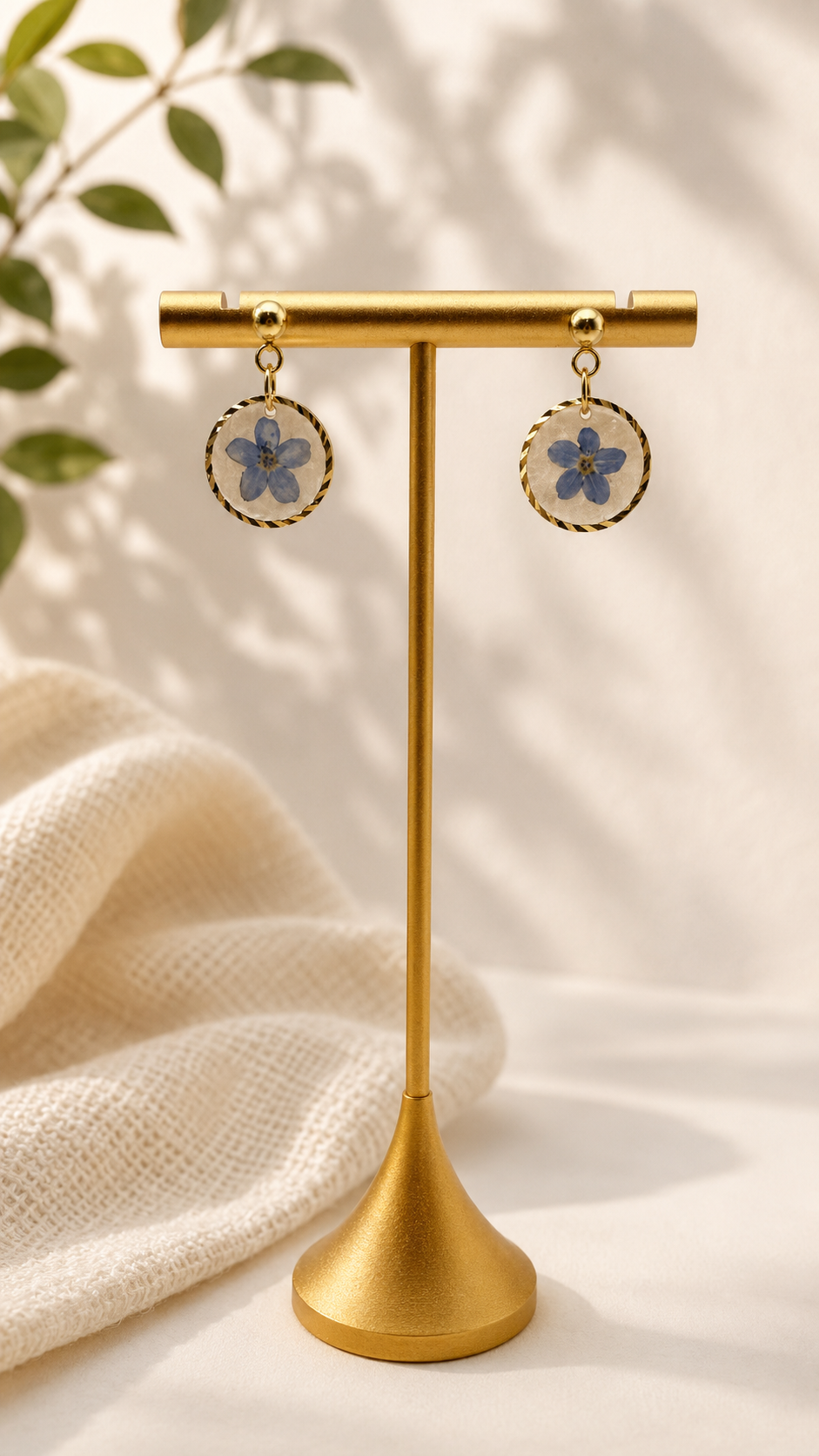 Pressed forget-me-not resin disc earrings with twisted 24k gold-plated bezel and ball stud