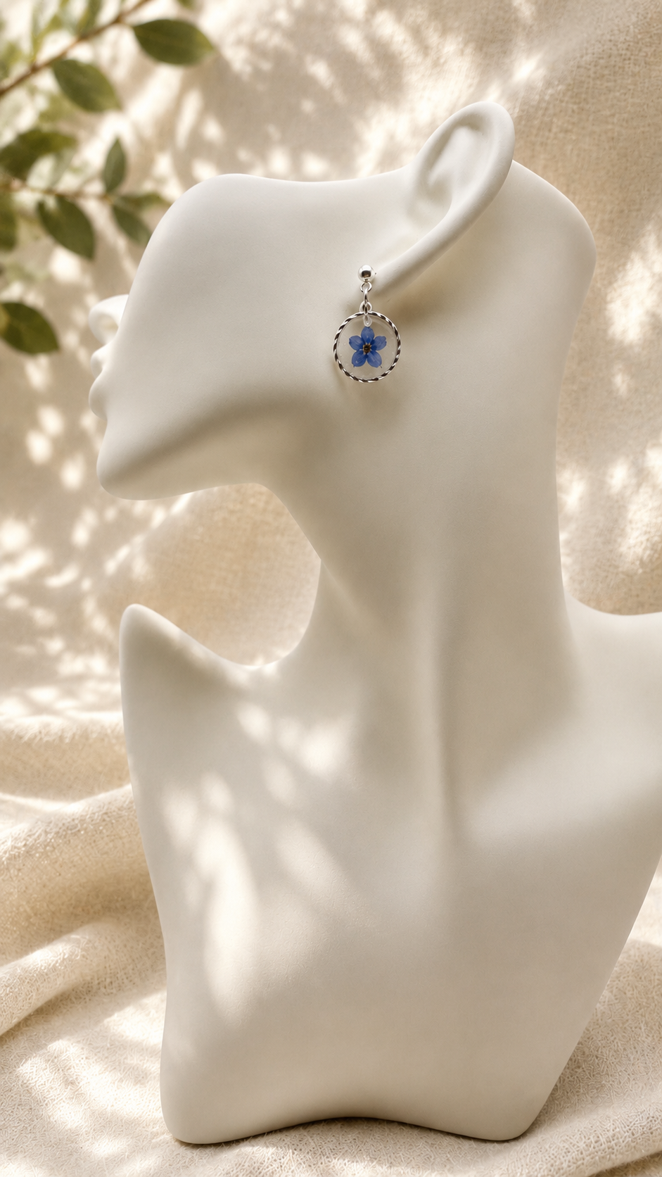 Pair of pressed forget-me-not resin disc earrings with twisted sterling silver bezel