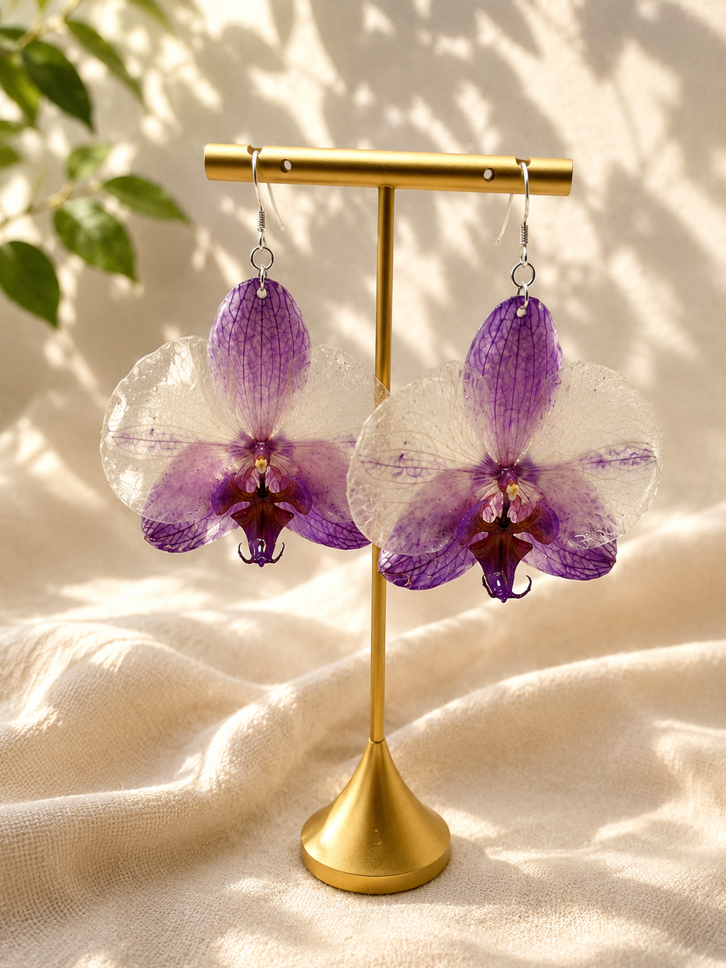 Purple orchid resin drop earring with real preserved orchid bloom and 925 sterling silver hook, handmade by Held Forever Studio in Lancashire UK