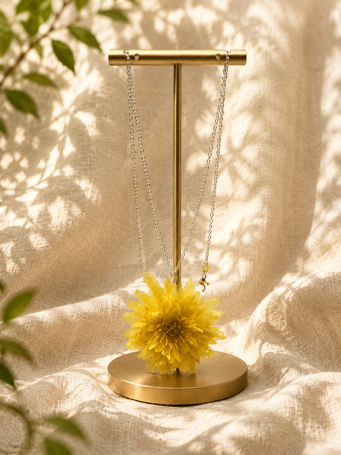 Yellow chrysanthemum resin pendant necklace with real dried bloom on 925 sterling silver chain, handmade by Held Forever Studio in Lancashire UK