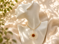 White daisy resin pendant necklace with real dried bloom on gold-plated chain, handmade by Held Forever Studio in Lancashire UK