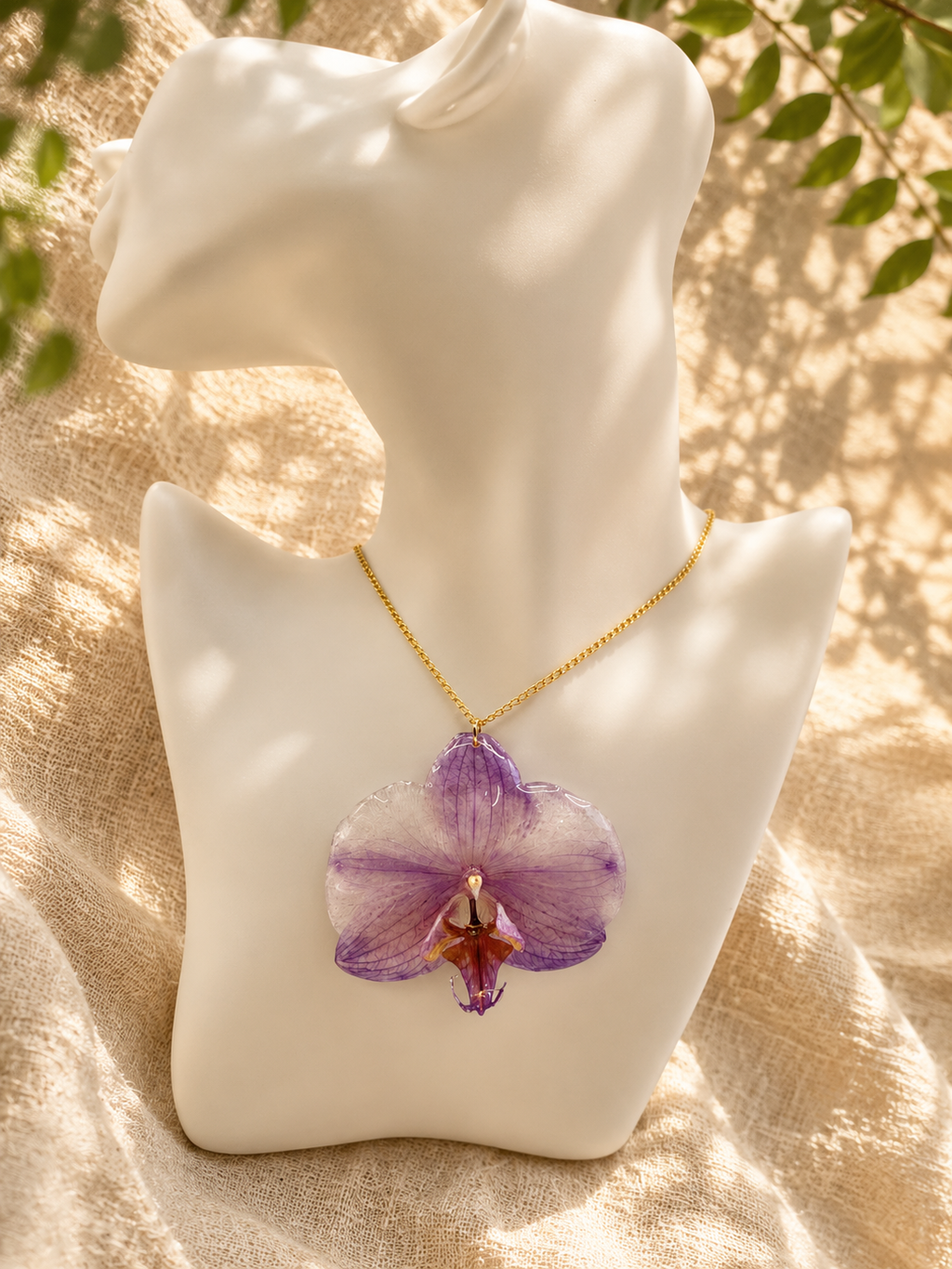 Purple orchid resin pendant necklace on a gold-plated chain, handmade by Held Forever Studio