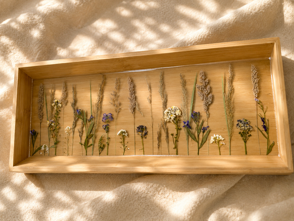 Top view of the long bamboo-framed pressed wildflower resin tray, handmade in Lancashire UK