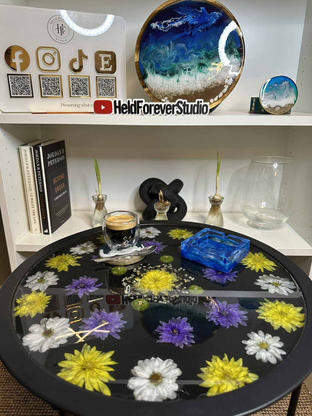 Close up of real pressed flowers set in resin tray table, handmade by Held Forever Studio