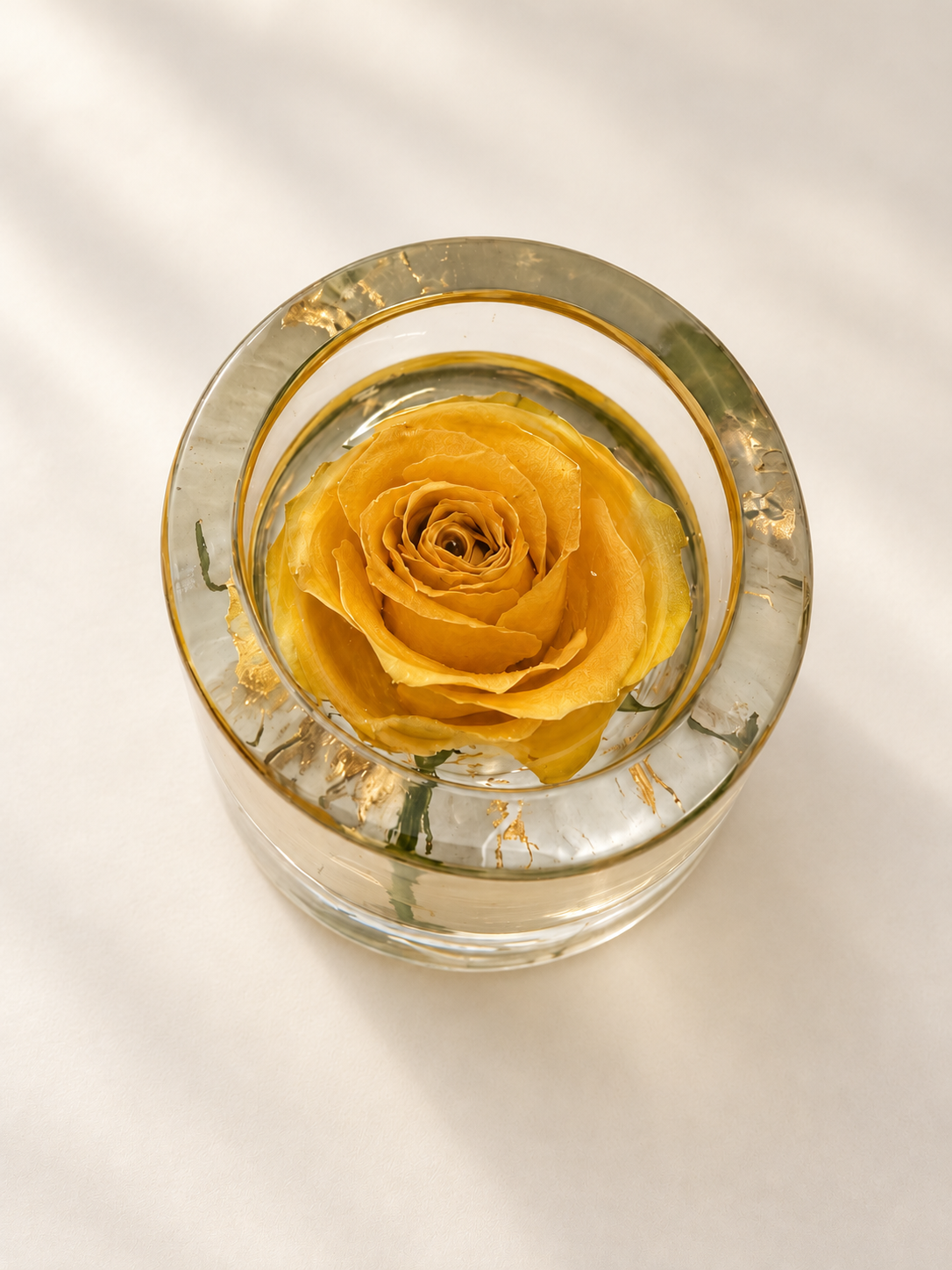 Top view of a real yellow rose inside a clear resin candle holder, handmade in Lancashire UK by Held Forever Studio